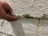 separation between sections of an interior wall due to wall shearing.