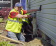 Mike helps install a push pier while laughing