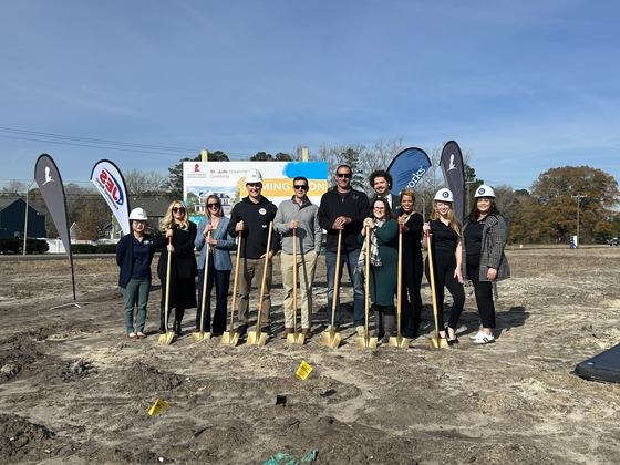 JES Foundation Repair crew standing with shovels at St. Jude Dream Home location.