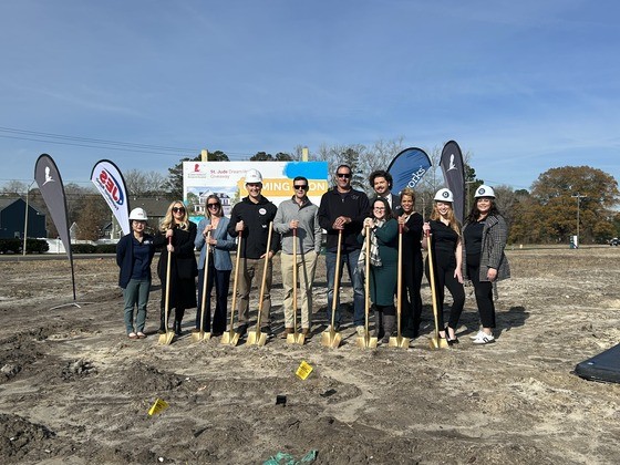 JES Foundation Repair crew standing with shovels at St. Jude Dream Home location.