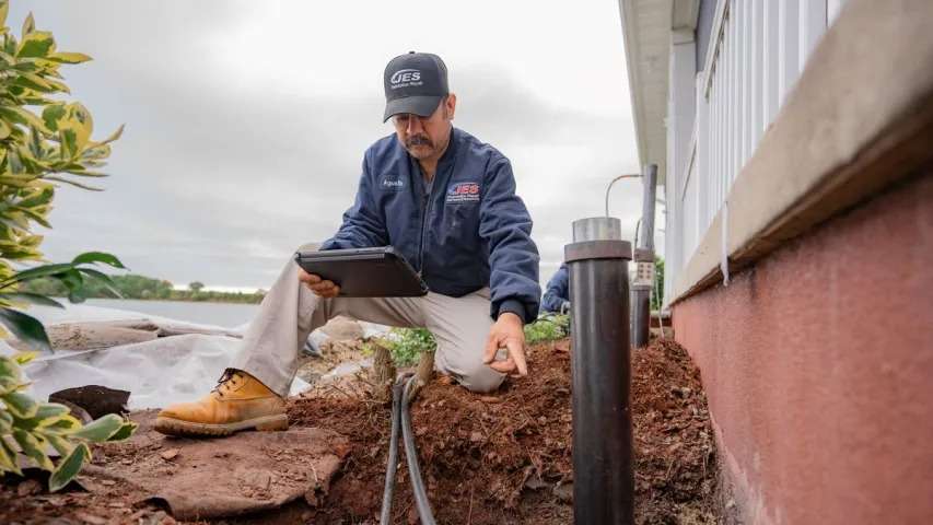 JES Foundation Repair inspector assessing house foundation