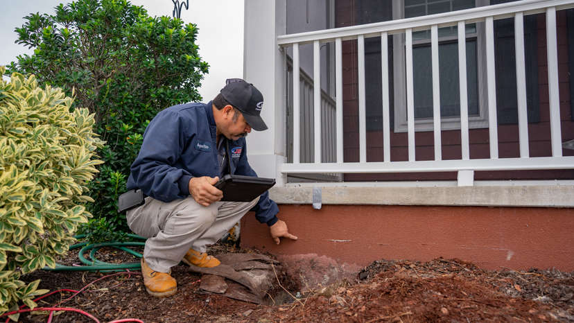 A JES technician inspects a settled foundation.