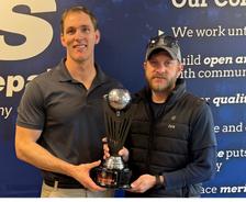 JES and Raptors FC holding a trophy at the VB International Indoor Cup