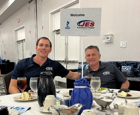Two JES Foundation Repair crew members at the 2025 Norfolk BBB Economic Forum