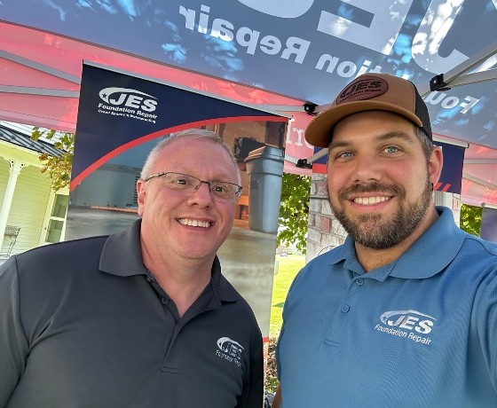 Two JES crew members at 33rd annual Hands & Harvest Festival sponsorship event