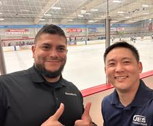 Two JES Foundation Repair crew members at Ashburn Ice House rink