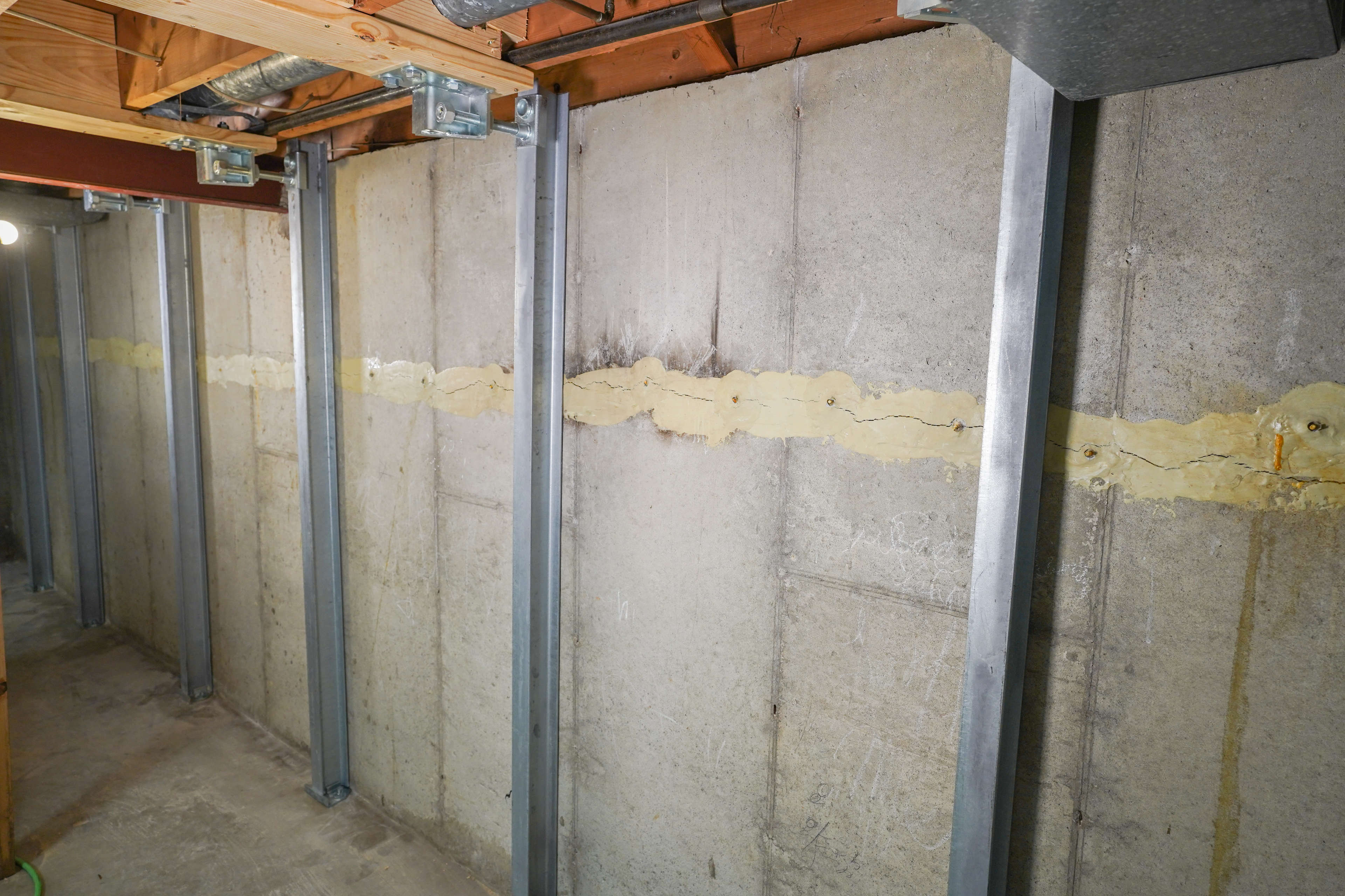 IntelliBrace wall repair system installed on a cracked basement wall