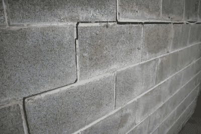 Stair-step cracks in an interior basement wall.