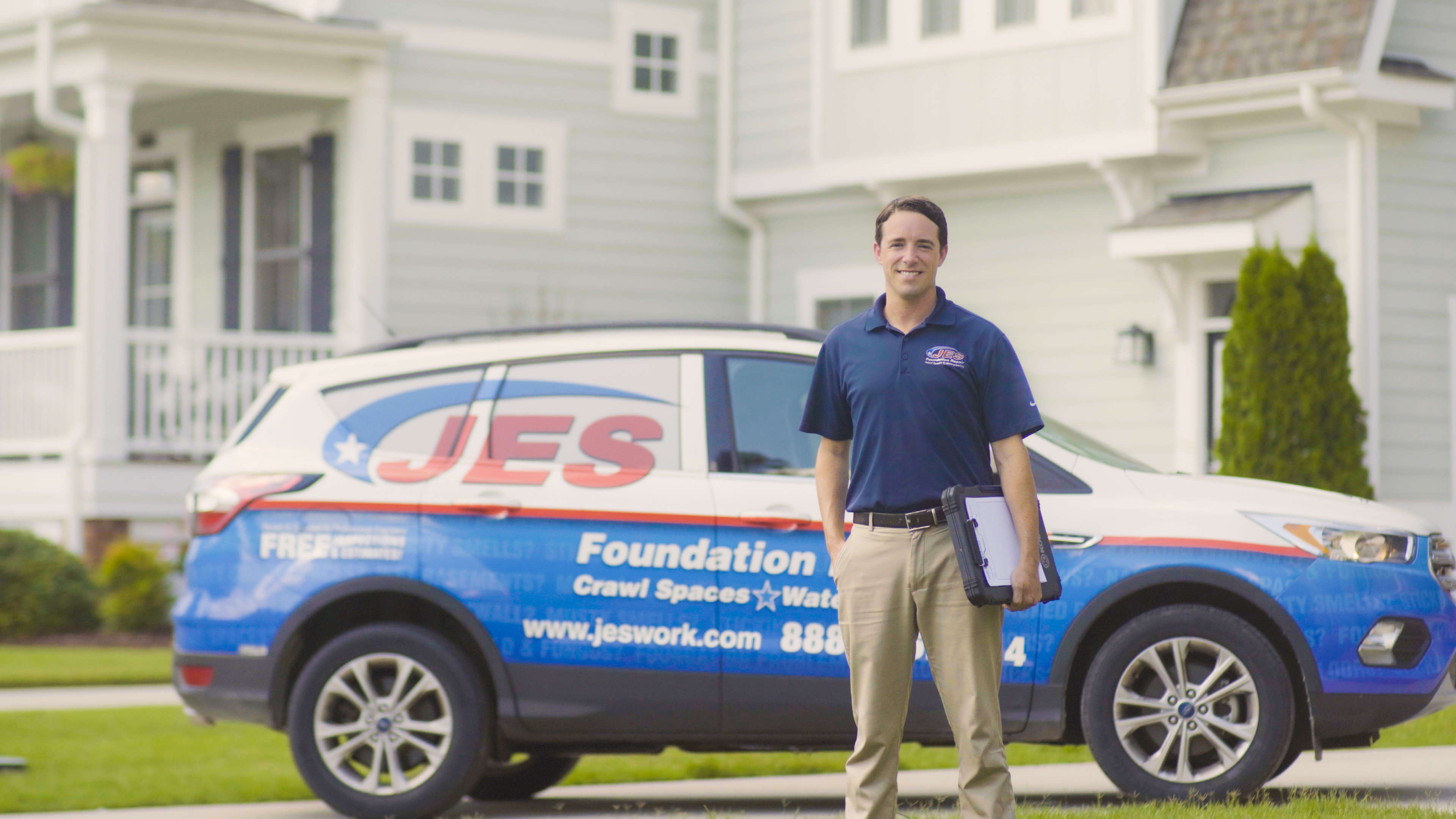inspector standing next to a JES vehicle