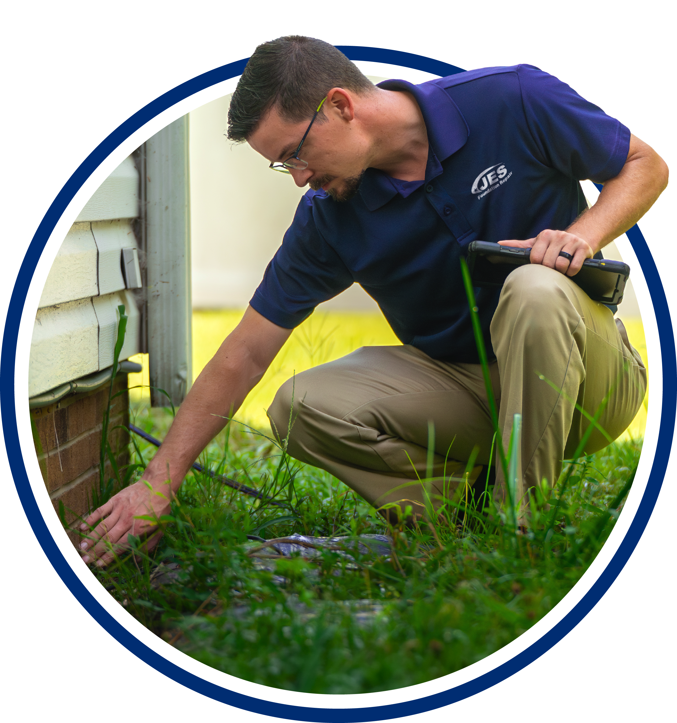 JES inspector looking at a home's exterior foundation