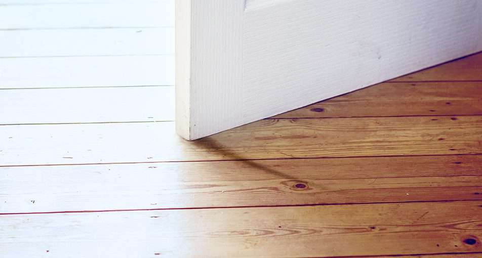 Sticking door on hardwood floor