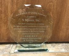 Clear glass award for N Square, Inc. from Federal Engineering & Testing, Inc., recognizing quality construction, 2017.