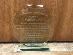 Clear glass award for N Square, Inc. from Federal Engineering & Testing, Inc., recognizing quality construction, 2017.