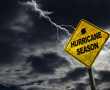 Hurricane Season sign against a stormy background.