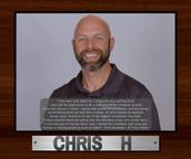 Smiling man with a beard in a framed photo, text about his work experience at Alpha below.