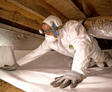 Alpha CFI installing vapor barrier in crawl space.