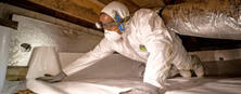 Alpha CFI installing vapor barrier in crawl space.