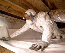 Alpha CFI installing vapor barrier in crawl space.