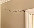 interior wall crack from door to corner