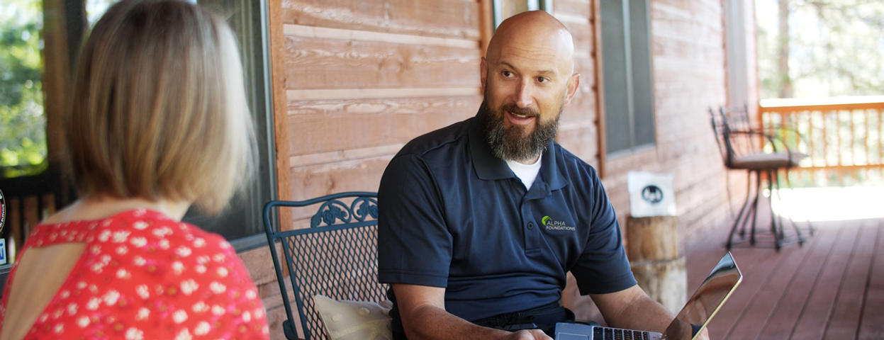 CFI sitting on patio with homeowner