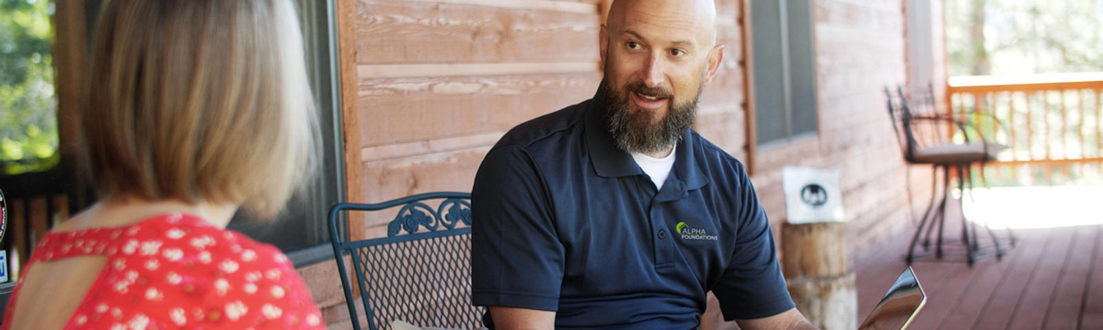 CFI sitting on patio with homeowner