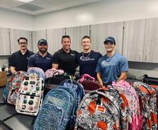 Alpha Foundations donating school supplies to local schools in need.