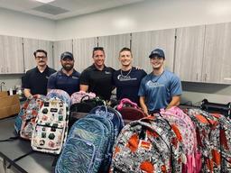 Alpha Foundations donating school supplies to local schools in need.