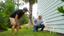 CFI Pointing at foundation while speaking with homeowner.
