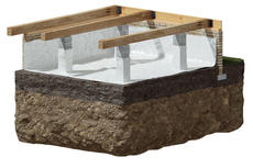 Illustration of a building foundation with wooden beams and white vapor barrier over soil layers.