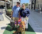 Alpha Foundations General Manager Nicholas Blasco with his wife and dog at Pupchella 2025