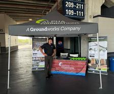 Alpha Foundations crew member at booth during Tampa Tarpon 2026 Game Day Activation