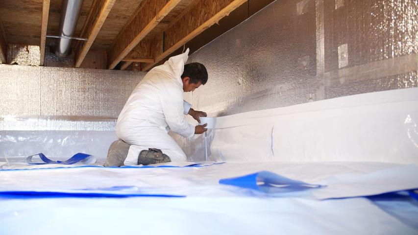 Crew installing crawl space encapsulation