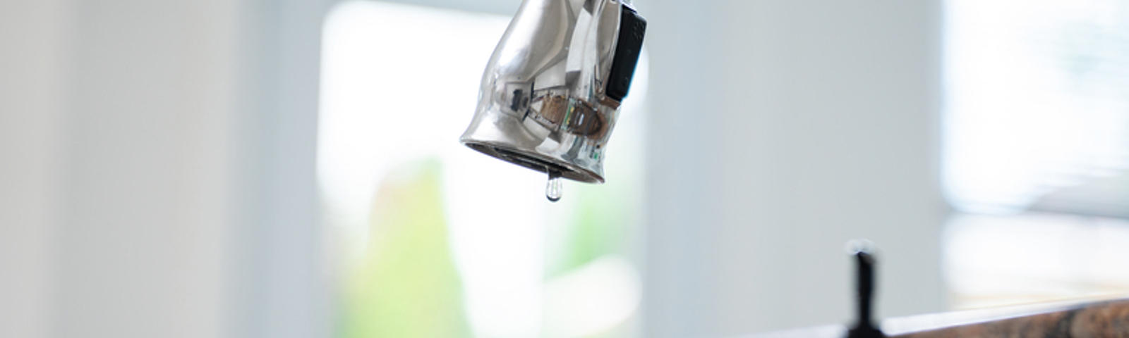 Leaky faucet close-up.