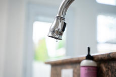 Leaky faucet close-up.
