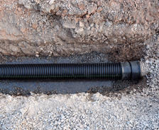 Buried Sewer Line in Road Construction Watermain Tubing Piping Water Infastructure Plumbing