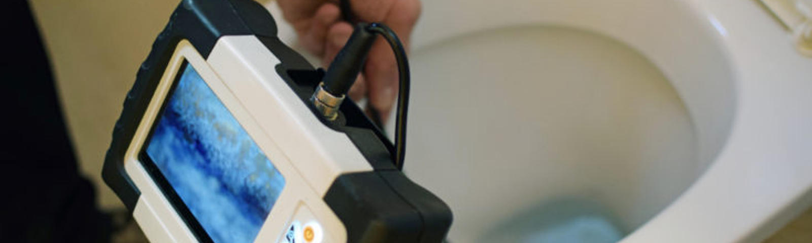 Snaking monitor testing clogged toilet