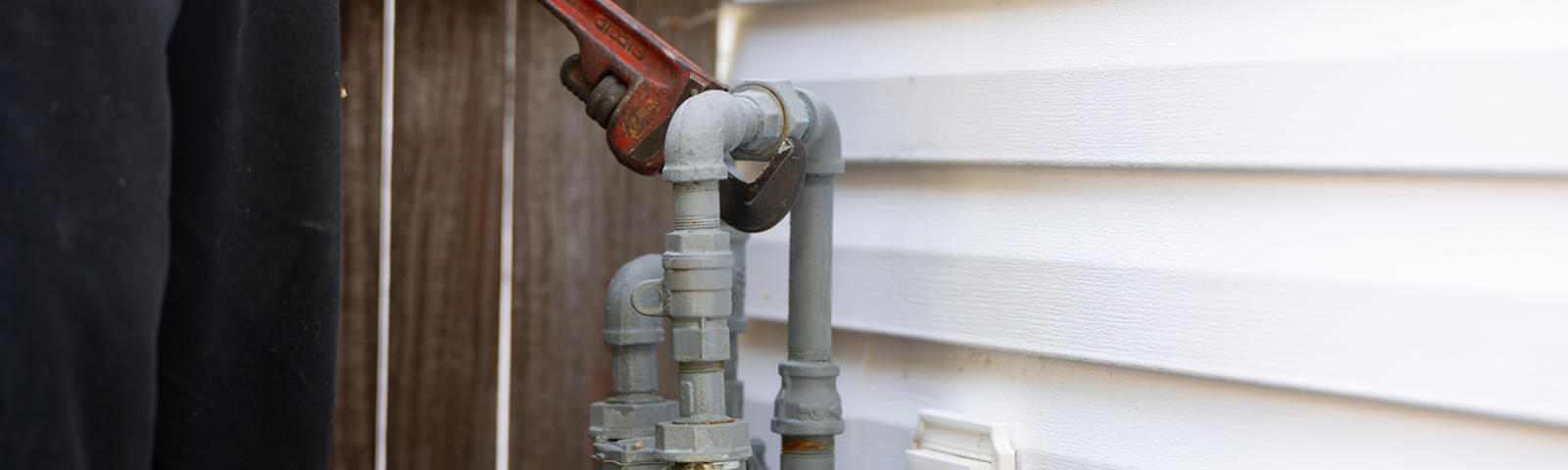 Close up gas line inspection with a wrench