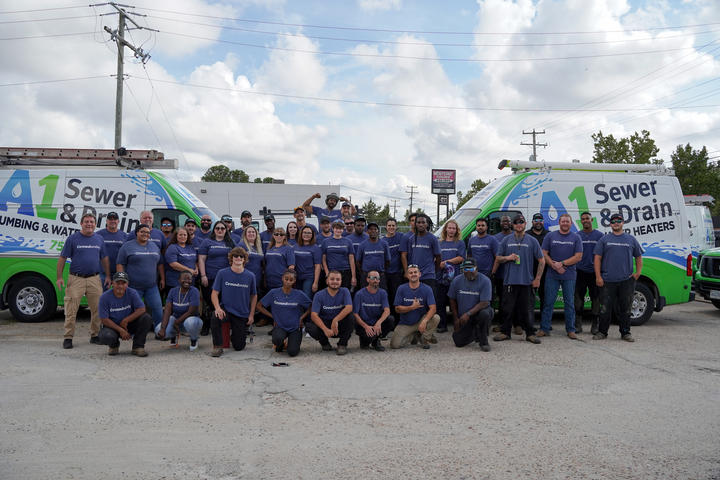 A1 Staff outside with work van.