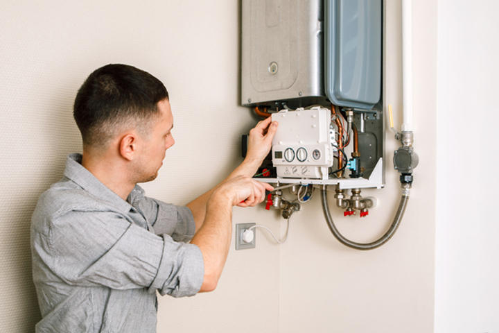 A1 Technician inspecting water heater.
