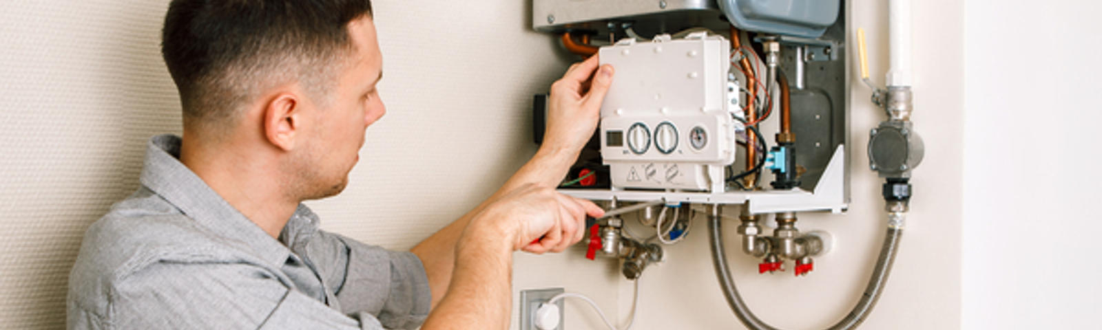 A1 Technician inspecting water heater.