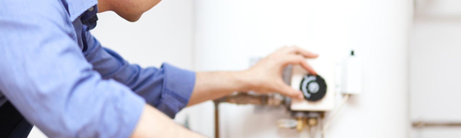 A1 technician checking water heater temperature.