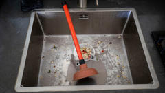 Sink drain back up with plunger.