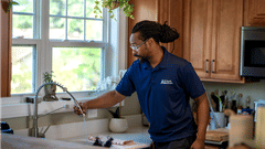 A1 employee servicing faucet.