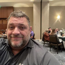 A1 Plumbling & Drain crew member smiling at Five Star Military Recognition Luncheon the Armed Services YMCA of Hampton Roads event