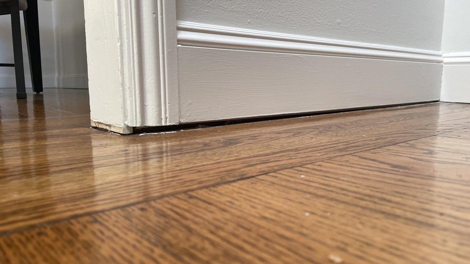 Close up of uneven and a bouncy floor in the interior of a home.