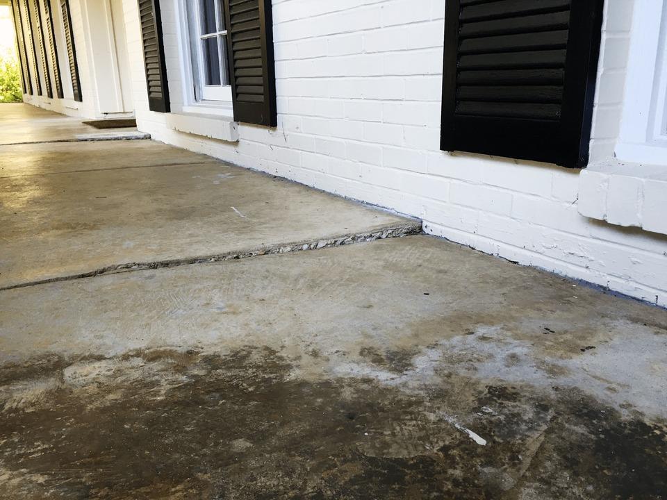 Concrete lifting on patio outside of home