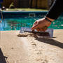 Crack in pool deck concrete being fixed