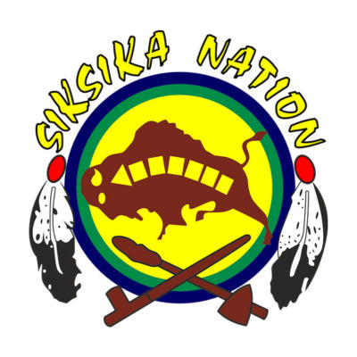 Siksika Nation logo with a buffalo, feathers, and two crossed tools on a yellow and green circle.