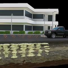Cross-section of a building with a truck parked outside, showing underground contamination beneath the surface.