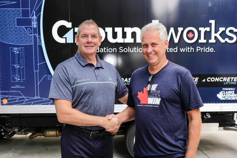 Matt Malone CEO of Groundworks shaking hand of founder of Clarke Basement Systems.